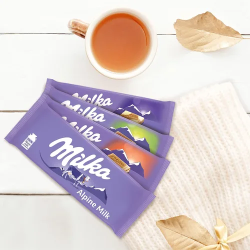 Miniatura 6 de Milka Paquete variado de barras de chocolate europeas, chocolate con leche alpino, manchas de vaca, fresa y avellana integral, 10 barras de 3.52