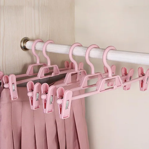 Miniatura 6 de DOITOOL Paquete de 10 perchas antideslizantes rosas para pantalones con clips ajustables, clips de plástico retráctiles para el hogar