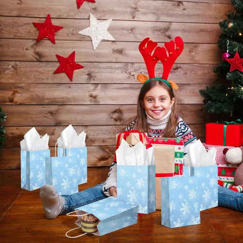 Miniatura 8 de Jectivs Paquete de 24 bolsas de regalo para fiestas, bolsas grandes y gruesas de papel kraft blanco con copos de nieve azul hielo con tejido blanco