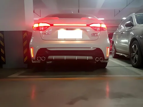 Miniatura 6 de iJDMTOY Luces reflectoras de parachoques LED de lente roja compatibles con Toyota Corolla Sedán 2019-22, funciona como faros antiniebla traseros