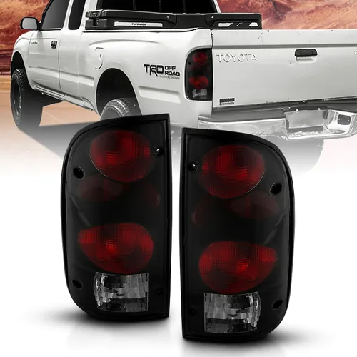 AmeriLite luces traseras de repuesto en humo negro para Toyota Tacoma 1995-2000 con juego de arnés de bombilla - Lado del pasajero y del conductor.