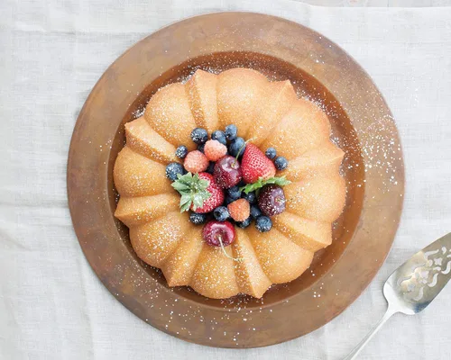 Miniatura 12 de Nordic Ware Bundt Original, 12 tazas, bronce