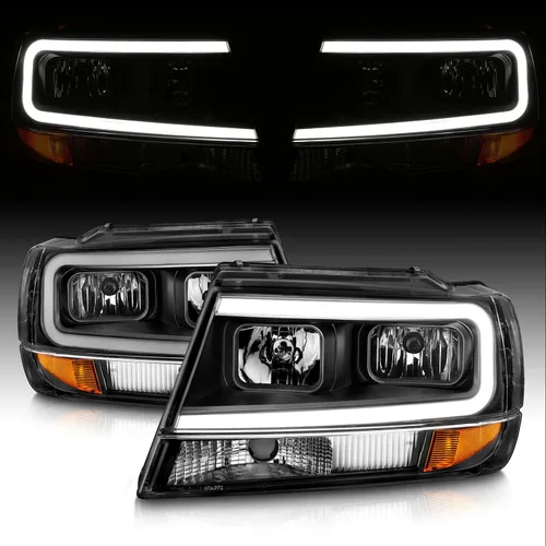 AmeriLite Juego de faros delanteros de repuesto para Jeep Grand Cherokee 1999-2004 con barra de luz LED, color negro transparente, lado del