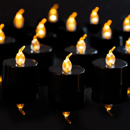 LANKER Paquete de 24 velas de té negras – Luces LED sin llama amarillas cálidas parpadeantes – Velas falsas de larga duración a pilas – Decoración