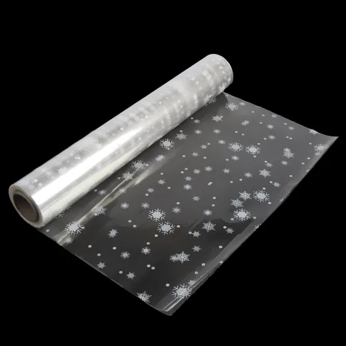 Rollo de envoltura de celofán navideño SULOLI - 32 pulgadas x 100 pies de copos de nieve, envoltura navideña para regalos, flores, cestas y canastas