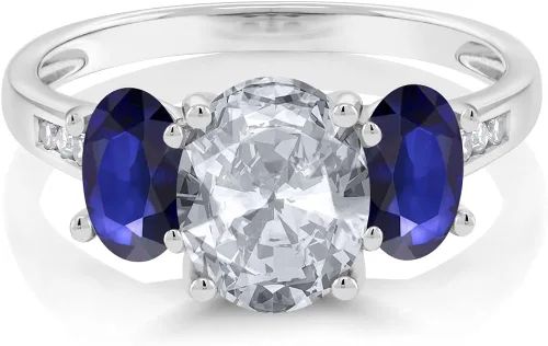 Miniatura 2 de Gem Stone King 10K White Gold Diamond Accent Oval White Topaz Blue Sapphire 3-Stone Ring 220 Ct Available 56789
