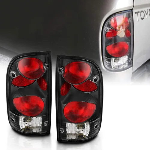 AmeriLite juego de luces traseras de repuesto en negro para Toyota Tacoma 1995-2000 + bombilla y arnés - lado del pasajero y del conductor.