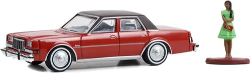 Greenlight 97150-C The Hobby Shop Series 15-1983 Dodge Diplomat with Woman in Dress Escala 1/64