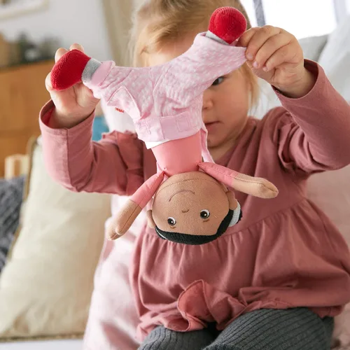 Miniatura 4 de HABA Snug Up Doll Rumbi - Muñeca suave de 10 pulgadas con cabello negro y overol rosa - Lavable a máquina para 18 meses en adelante