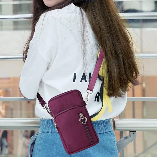 Miniatura 7 de Bolso cruzado de nailon para mujer para viaje, bolso de hombro para teléfono celular con pulsera, brazalete deportivo, cartera para teléfono Púrpura