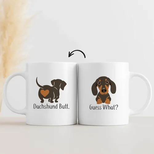 QUICQOD Taza divertida de perro salchicha para mamá y amantes, taza de café blanca, adivina qué trasero de 11 onzas, regalo de Navidad, Acción de