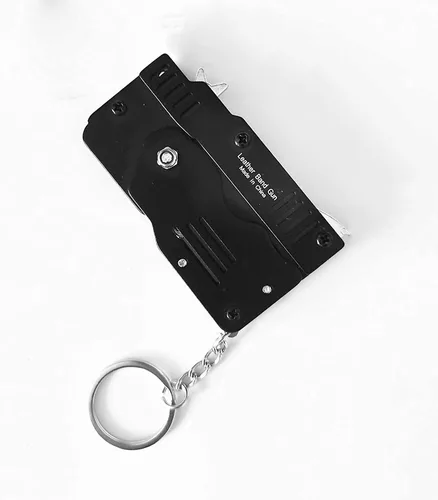 Miniatura 3 de 2 paquetes de mini pistola de goma plegable de metal con llavero y más de 100 bandas de goma.