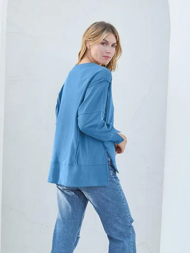 Miniatura 3 de MEROKEETY Sudadera holgada casual de manga larga tipo farol para mujer, cuello redondo, abertura lateral, 2023