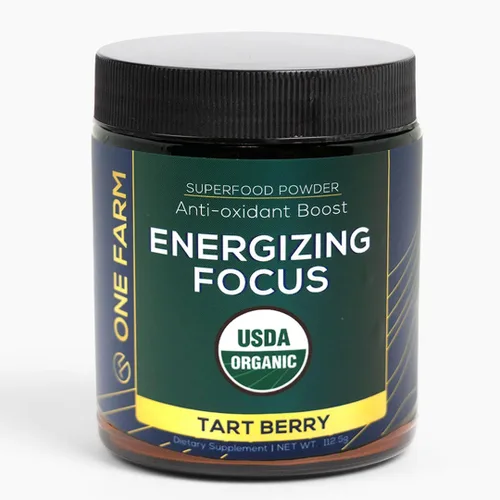 Mezcla de polvo energizante One Farm con grosella negra orgánica USDA, matcha, melena de león, cordyceps, rodiola y más en un frasco de vidrio