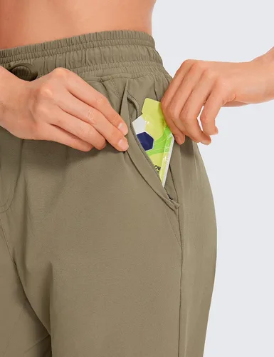 Miniatura 4 de CRZ YOGA Pantalones deportivos para mujer, impermeables, para exteriores, golf, atléticos, ligeros, con bolsillos con cremallera, de 27 pulgadas