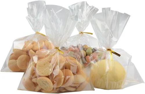 COOLAKE Bolsas transparentes para golosinas, 100 bolsas de celofán de 6 x 8 pulgadas, bolsas transparentes para dulces con 100 lazos dorados para