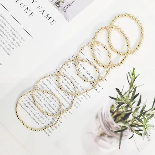 Miniatura 6 de Pulseras de oro para mujer, chapado en oro de 14 quilates, apilables, juego de pulseras elásticas de cuentas de oro, joyería de oro para mujer
