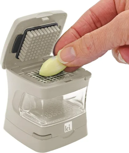 Miniatura 7 de Prensa de ajo Garlic-A-Peel, trituradora, cortadora, picadora y contenedor de almacenamiento - Incluye pelador de ajo de silicona - Fácil de limpiar