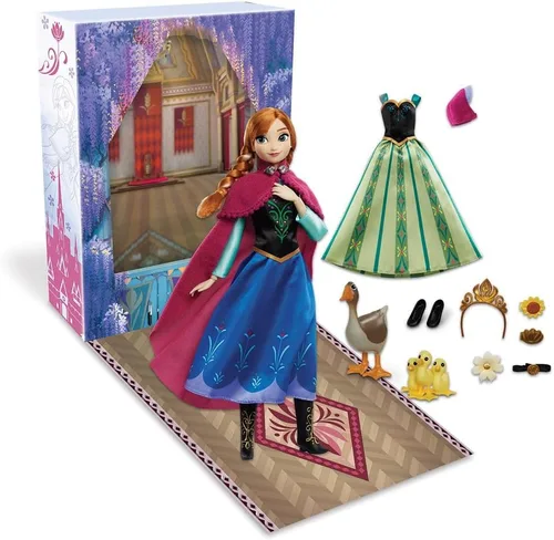 Disney Store Muñeca oficial de Anna Story (traje de viaje) – 11 pulgadas – Incluye libro para colorear y vestido adicional, muñeca princesa con