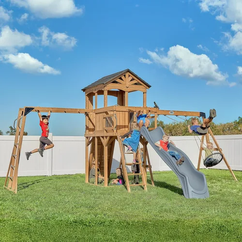 Miniatura 13 de Conjunto de columpios Backyard Discovery Sterling Point de madera de cedro con tobogán de ola, casa club elevada, puente de madera, pared de roca