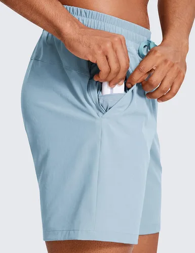 Miniatura 4 de CRZ YOGA Pantalones cortos de entrenamiento sin forro para hombre, 7 pulgadas, secado rápido, para correr, deportes, gimnasio, con bolsillos