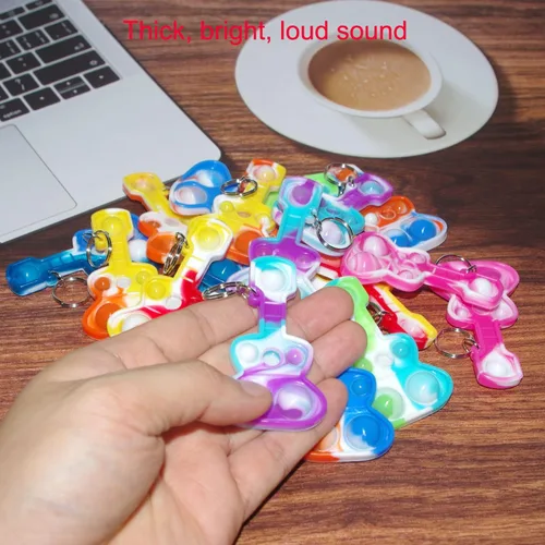 Miniatura 3 de Paquete de 20 llaveros de burbujas para ansiedad con diseño de arco iris a granel, música y guitarra pop, regalo para Pascua, niños y niñas, regalos
