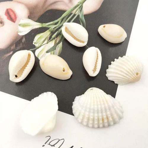 Miniatura 3 de 100 cuentas redondas y ovaladas blancas de 0.433 x 0.709 in, perfectas para joyas temáticas de playa de verano